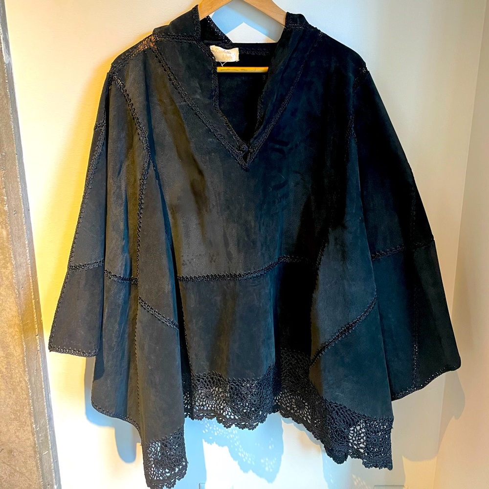 Vintage suede and crochet poncho with front pocket and hood. One size fits all.
